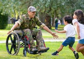 Soldier reunited with children on a sunny day. Veterans-Affairs-Disability-Pension-payments-be-excluded-from-child-support-calculations